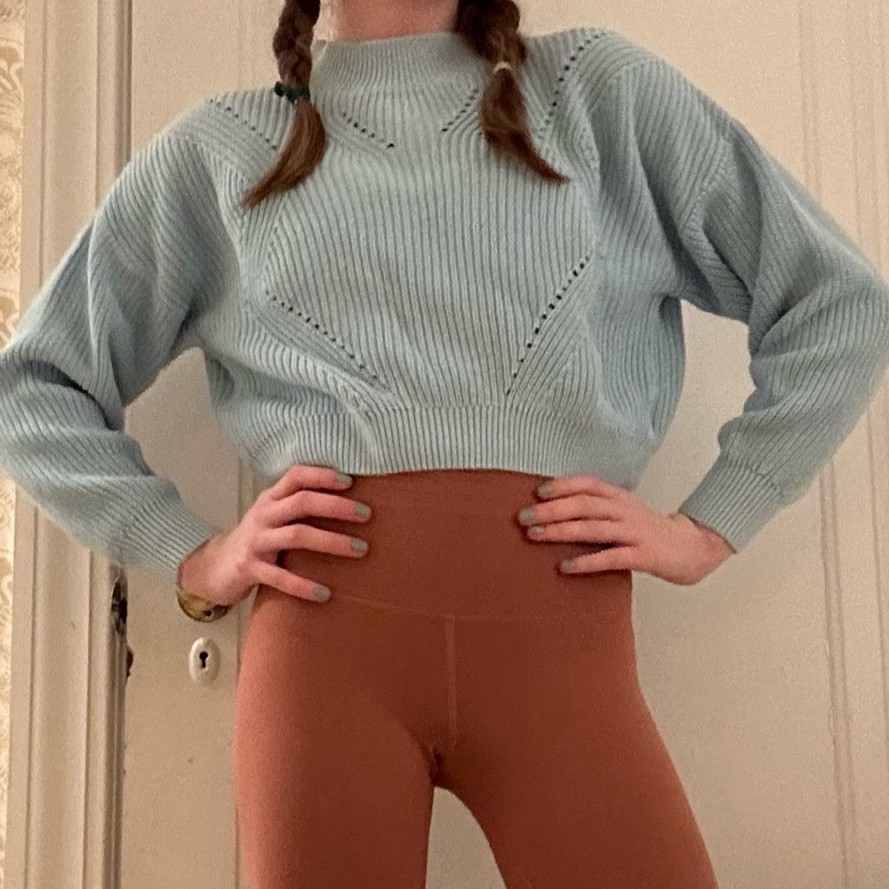 This is a cute blue sweater from H&M for 12-14 year olds.